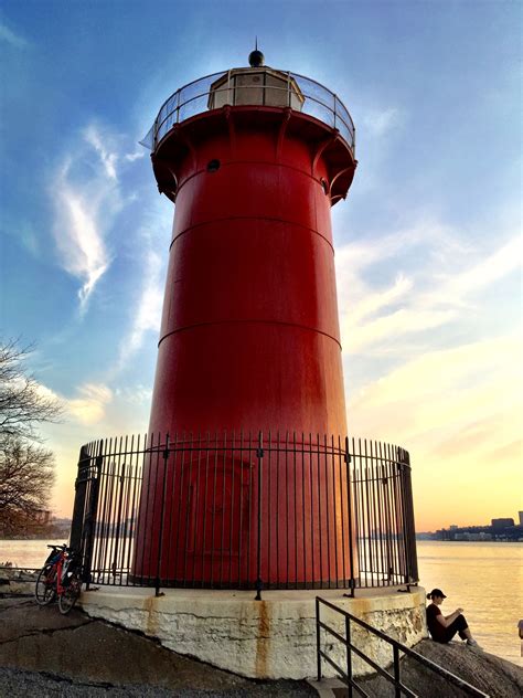 red house lighthouse with metal bridge|little red lighthouse new york.